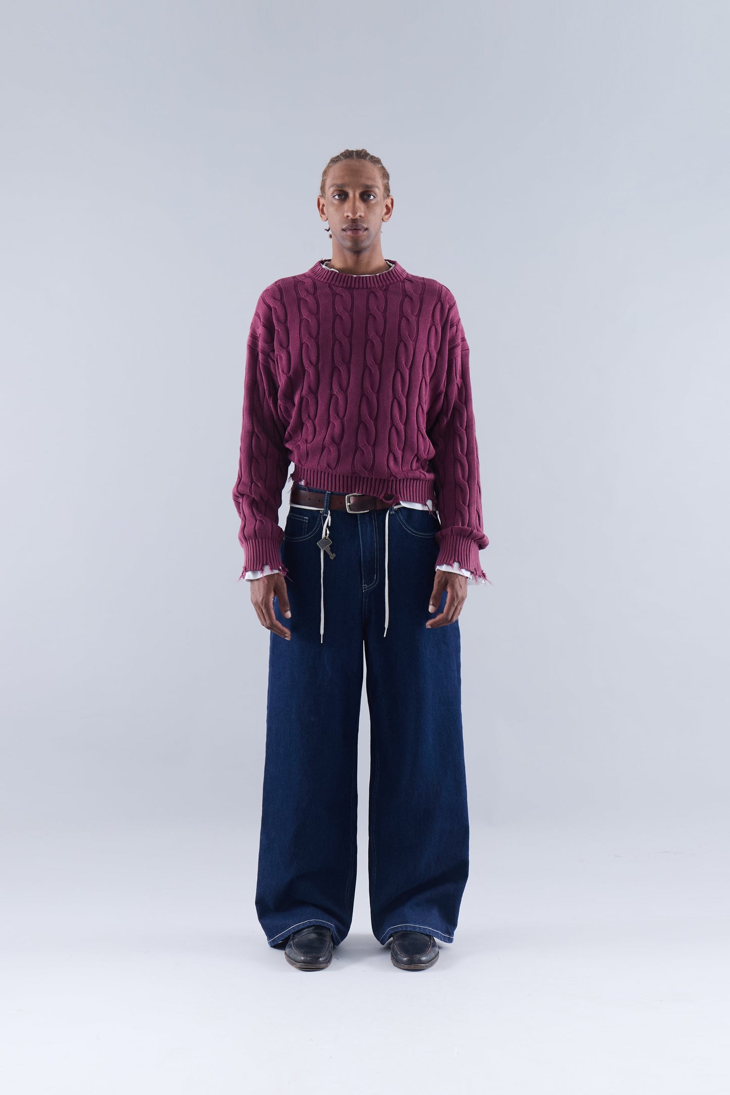 CABLE KNIT DISTRESSED SWEATER